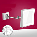 Stainless steel folding bathroom makeup mirror measuring 8.5 inches square in a choice of four finishes.