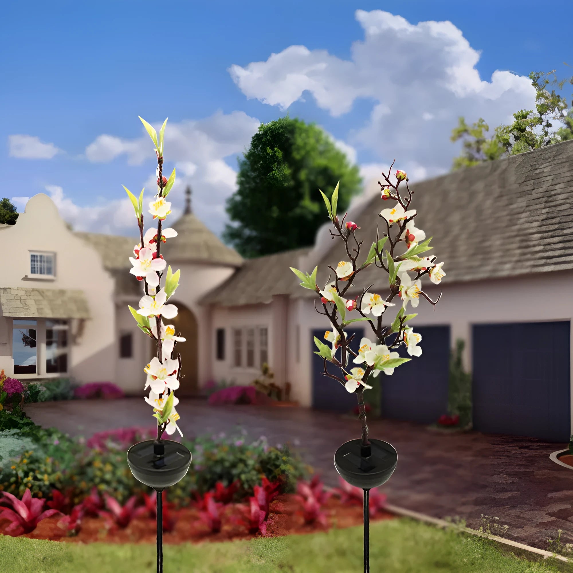 Solar cherry tree garden decoration light with ground insert spike on a lawn.