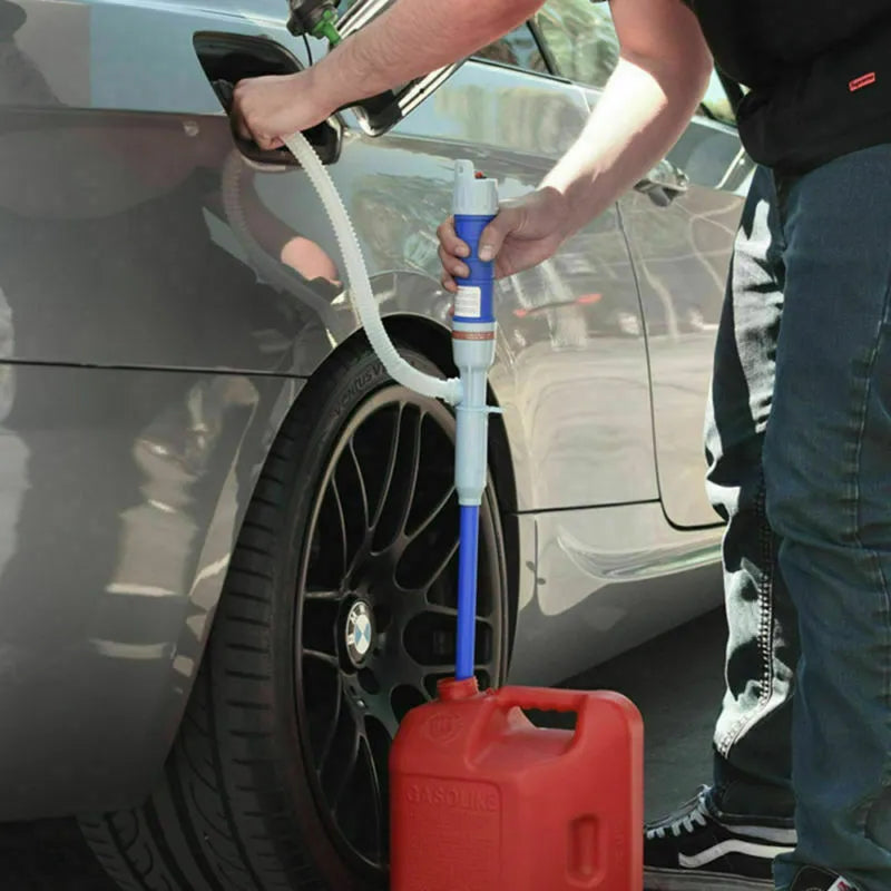 Manual hand-operated siphon pump with blue flexible tubing for transferring gasoline and oil.