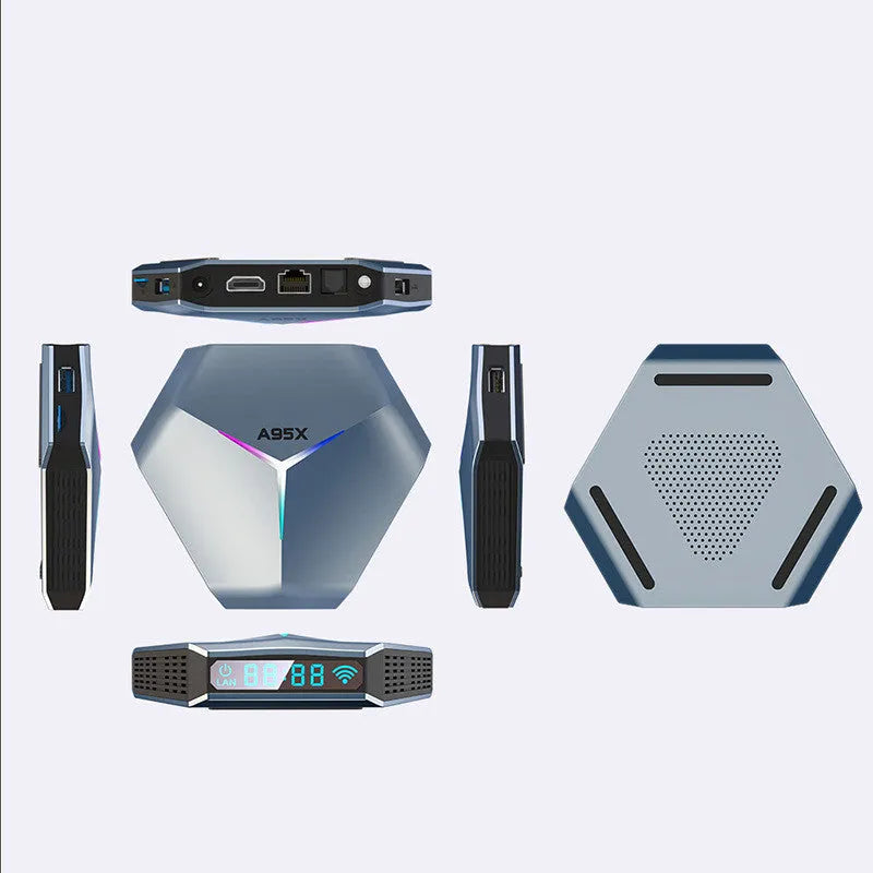 Android 4K TV box set-top box with remote control and cables on a wooden surface.