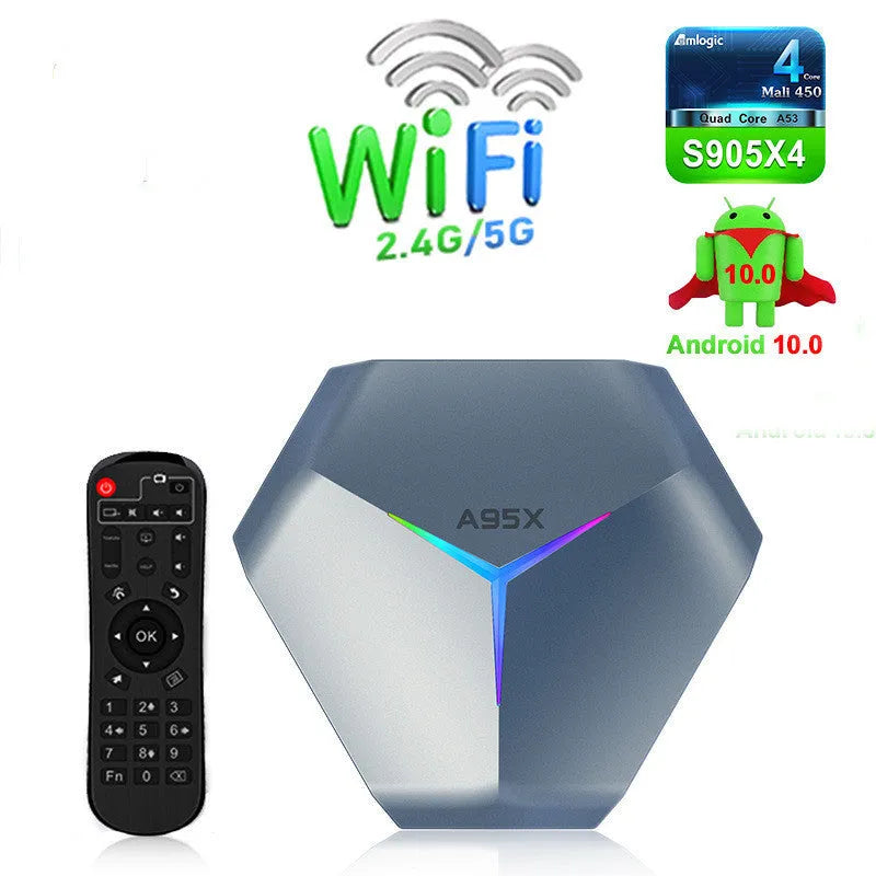 Android 4K TV box set-top box with remote control and cables on a wooden surface.