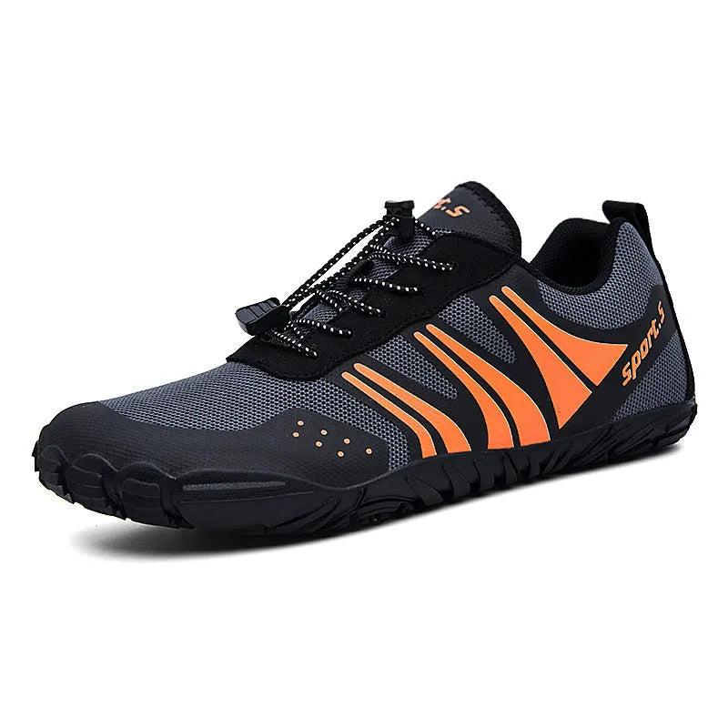 Outdoor quick-dry wading shoes in red with mesh upper and rubber sole on a rocky shore