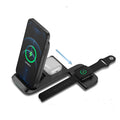 Black foldable wireless charging station showing three devices charging simultaneously