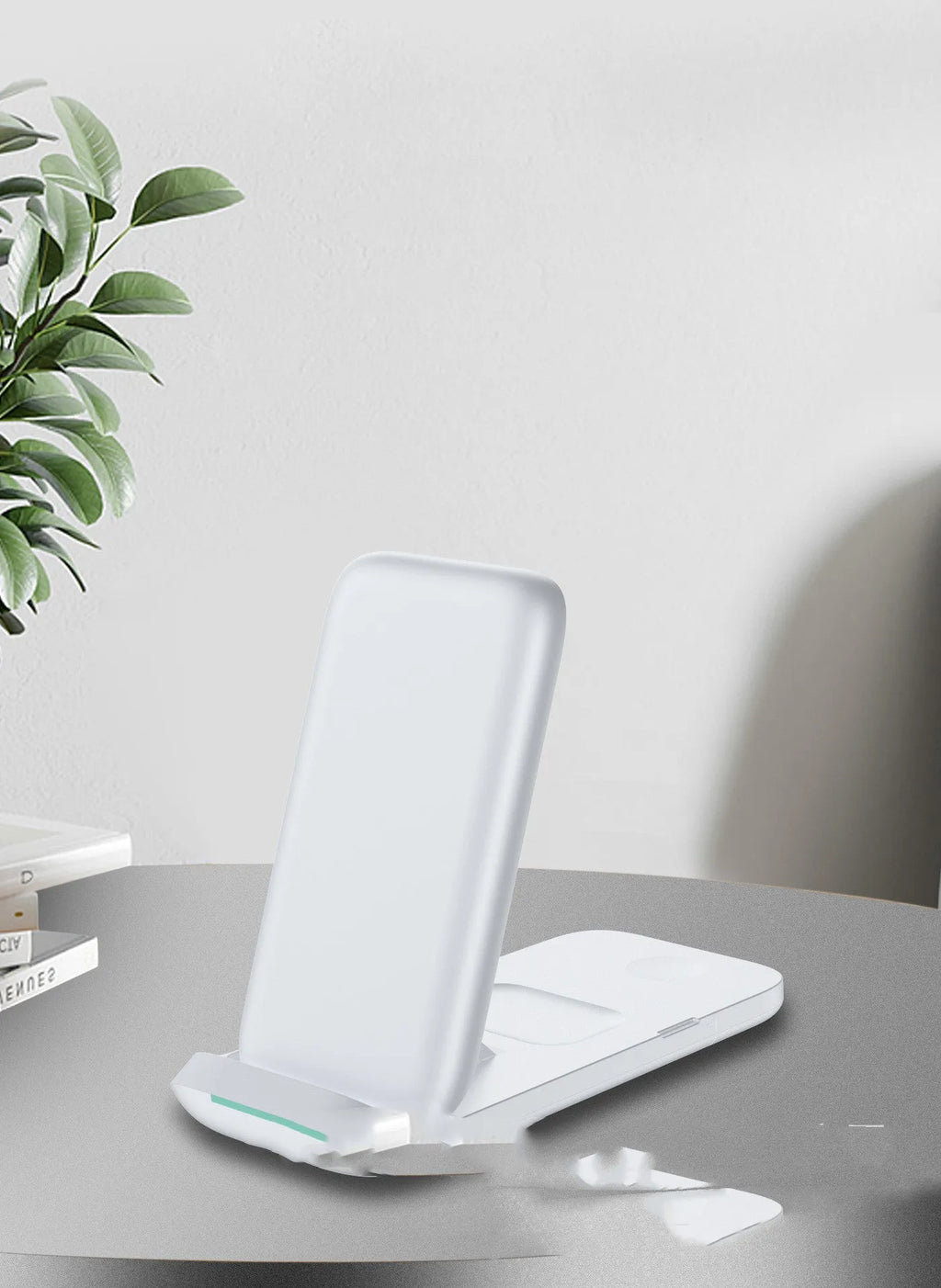 Black foldable wireless charging station showing three devices charging simultaneously