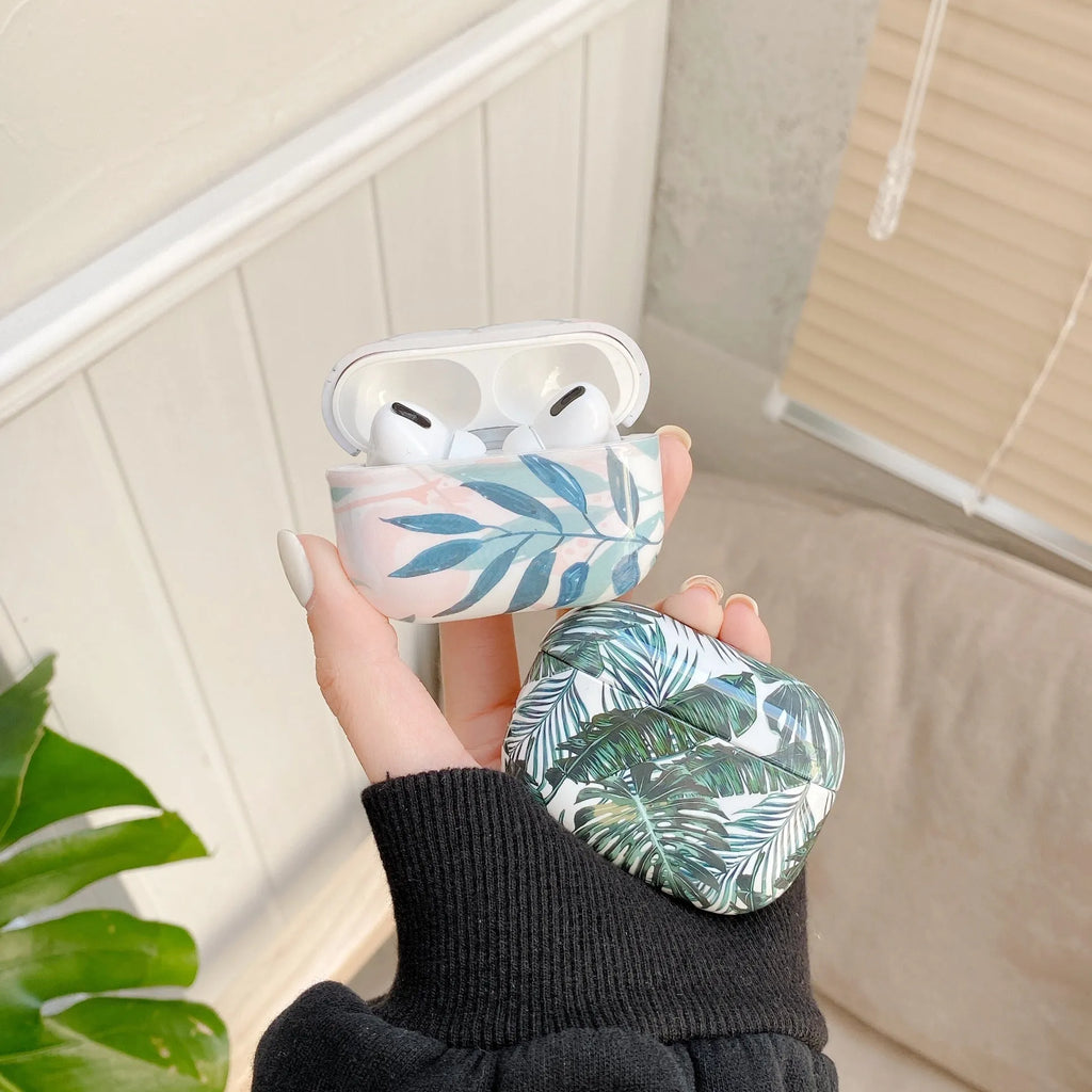 Blue and green TPU AirPods cases with banana leaf pattern for AirPods 1, 2, and Pro models.