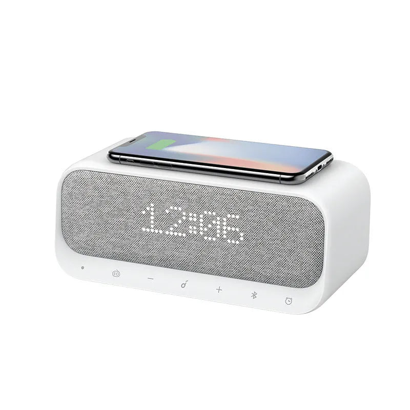 Anker Soundcore white Bluetooth speaker with wireless charging pad and alarm clock display