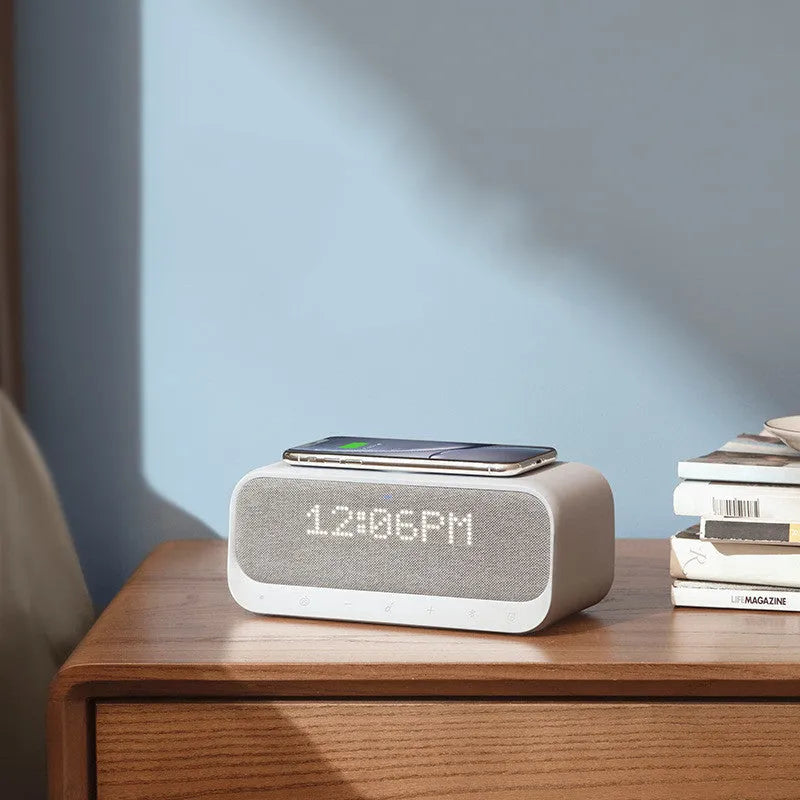 Anker Soundcore white Bluetooth speaker with wireless charging pad and alarm clock display