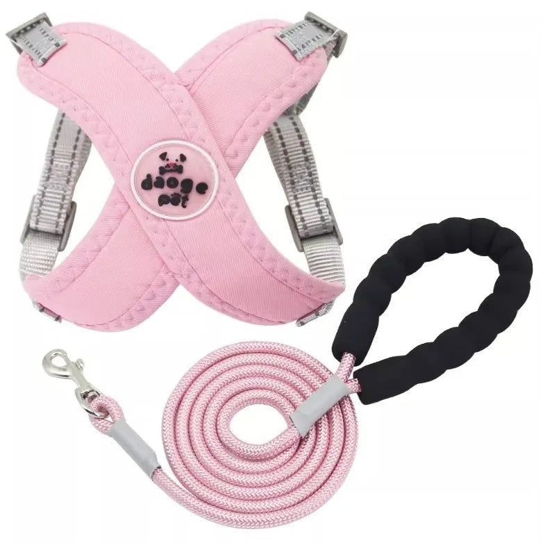 Blue polyester dog vest with an attached hand holding rope laid flat on a white background.