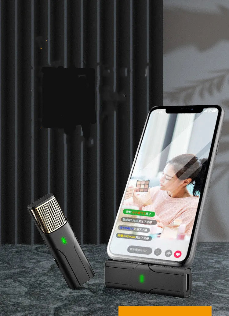 Black wireless lavalier microphone system with compact receiver for smartphones and cameras