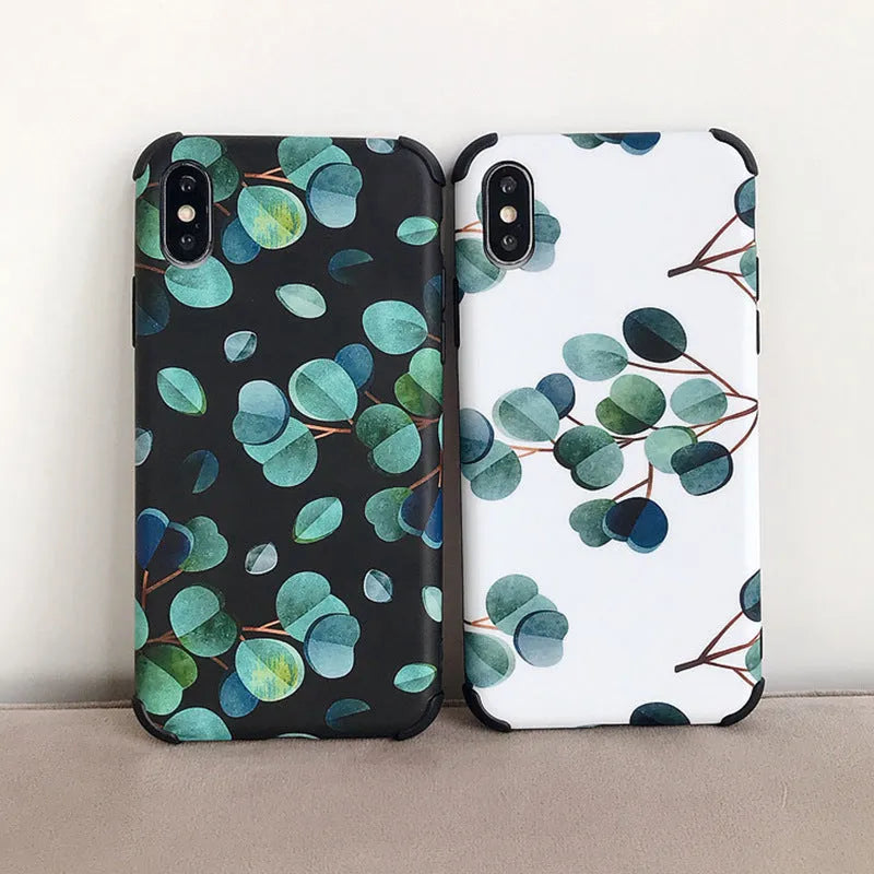 Black silicone iPhone case with a detailed raised leaf pattern design on the back.