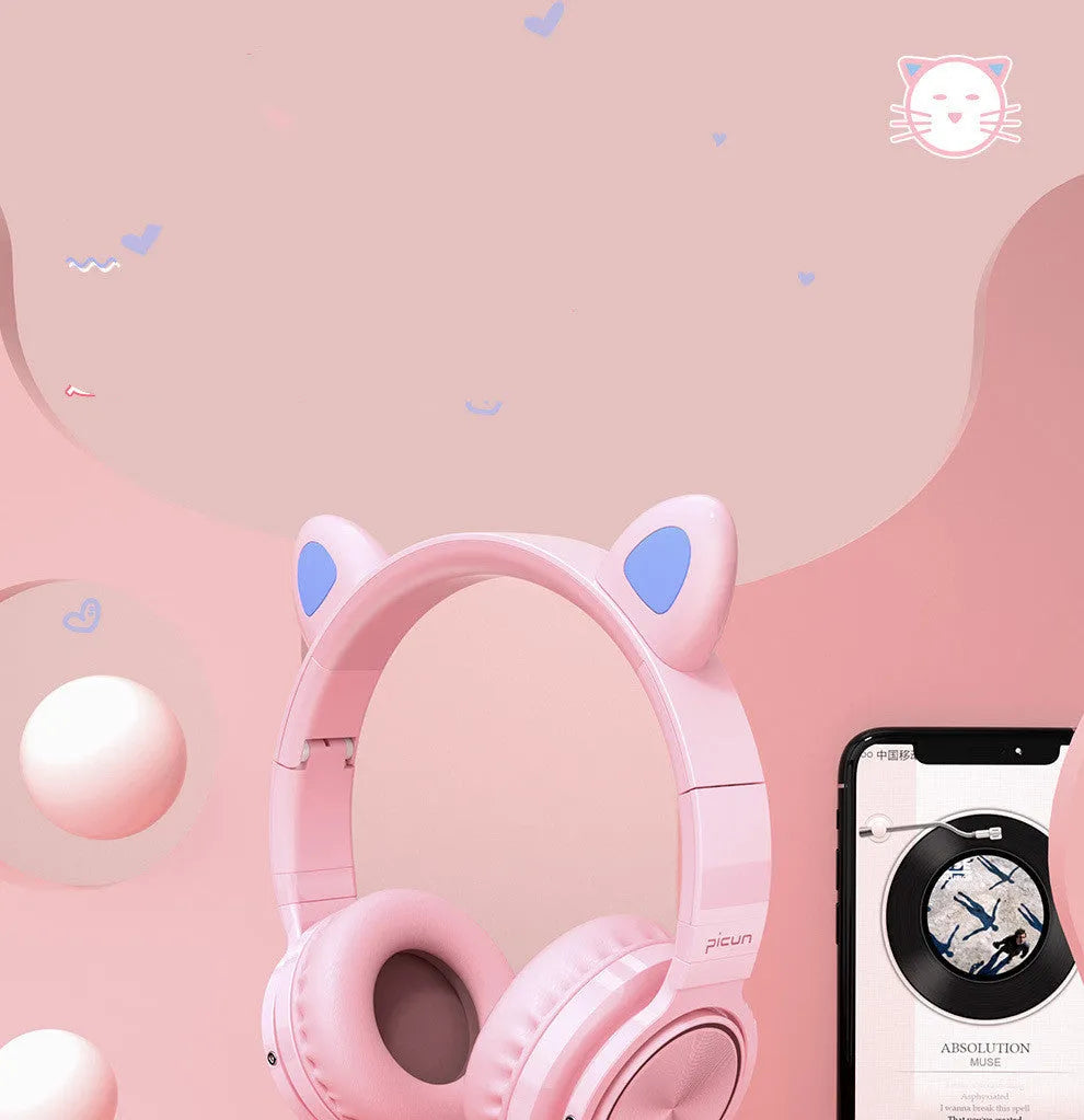 Pink and white wireless Bluetooth over-ear headphones with protein ear cushions and braided charging cable