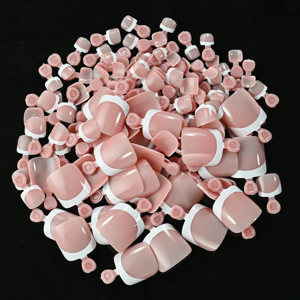 Box of 120 French white edge nude full square short artificial nail tips on a white background.