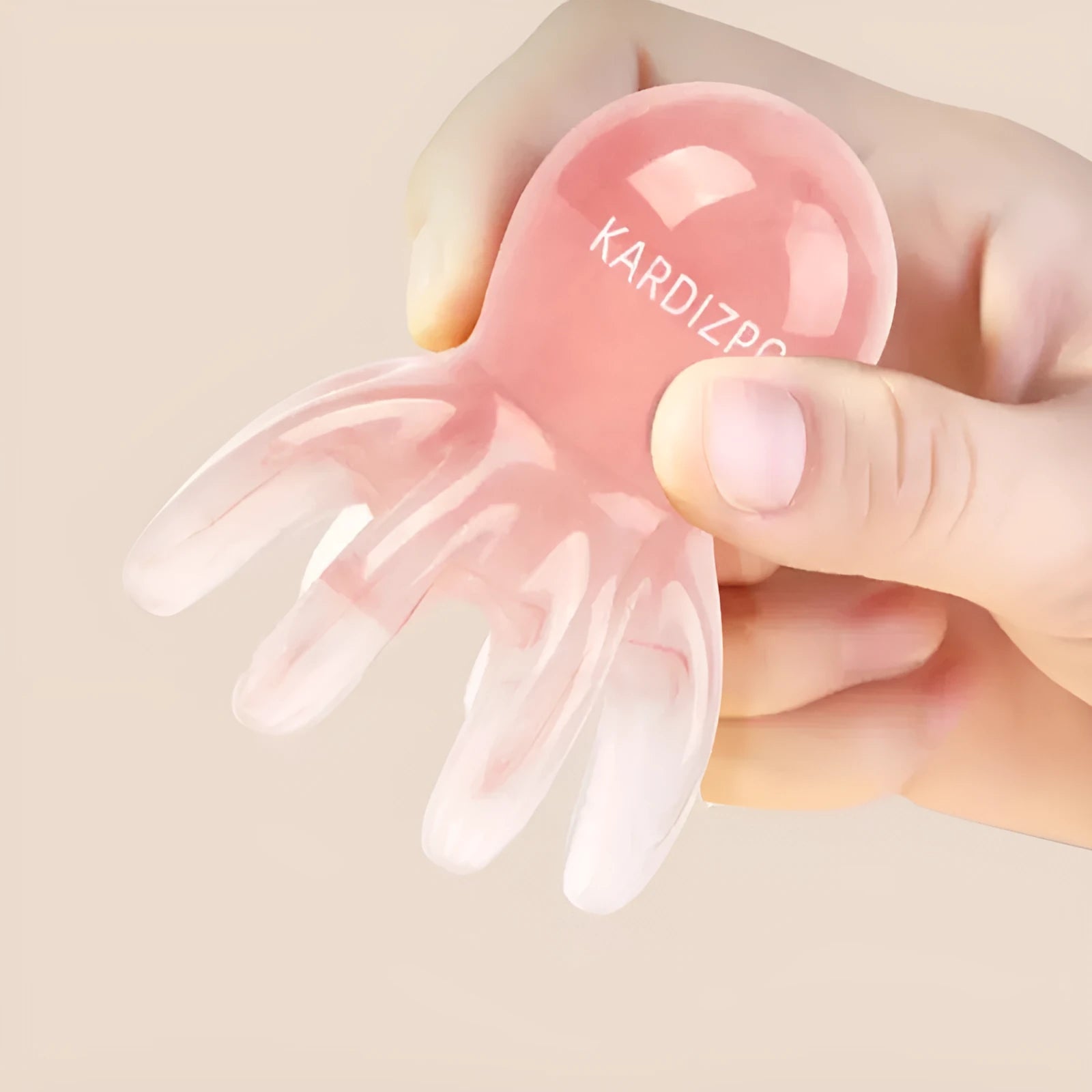 Pink natural resin octopus-shaped massage comb with storage bag.
