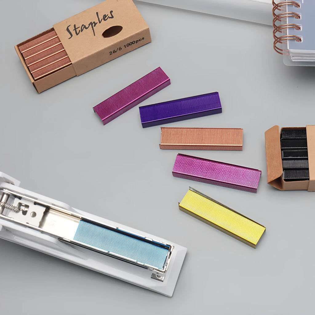 Box of 1000 metal office staples showing colour options: black, purple, rose gold, rose red