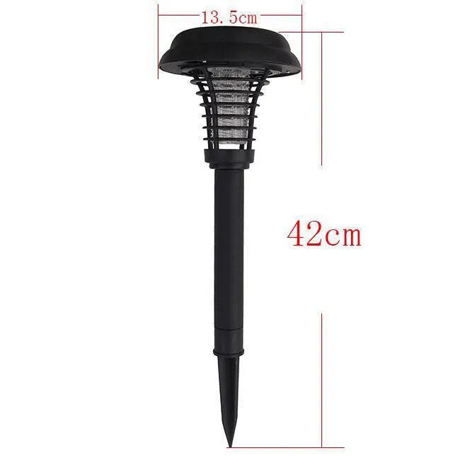 Black solar powered insect killing mosquito lawn lamp with white and purple light LEDs in a garden setting.