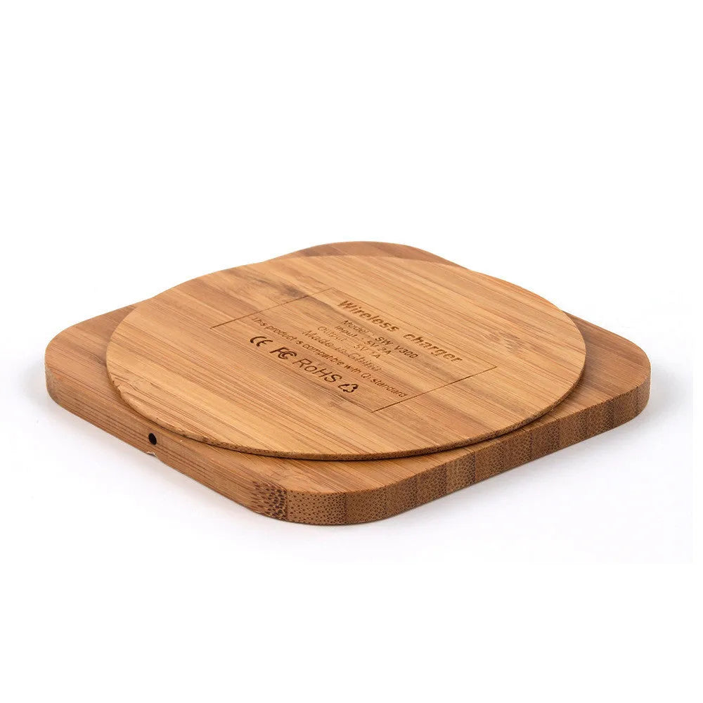 Square brown bamboo wood 5W wireless charger with green LED indicator on desk