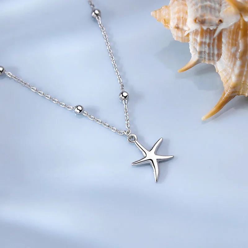 Women's S925 sterling silver anklet with starfish charm and round bead chain.