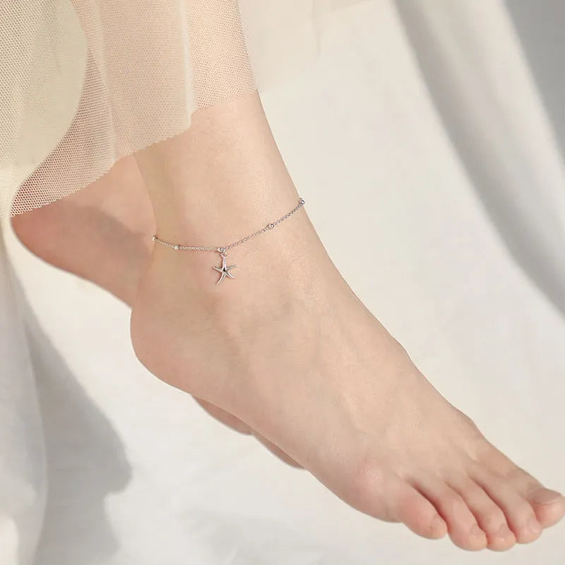 Women's S925 sterling silver anklet with starfish charm and round bead chain.