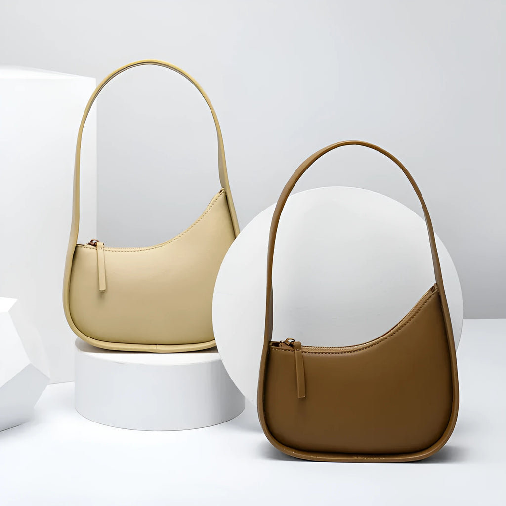 Half moon shaped leather women's shoulder bag with wide strap