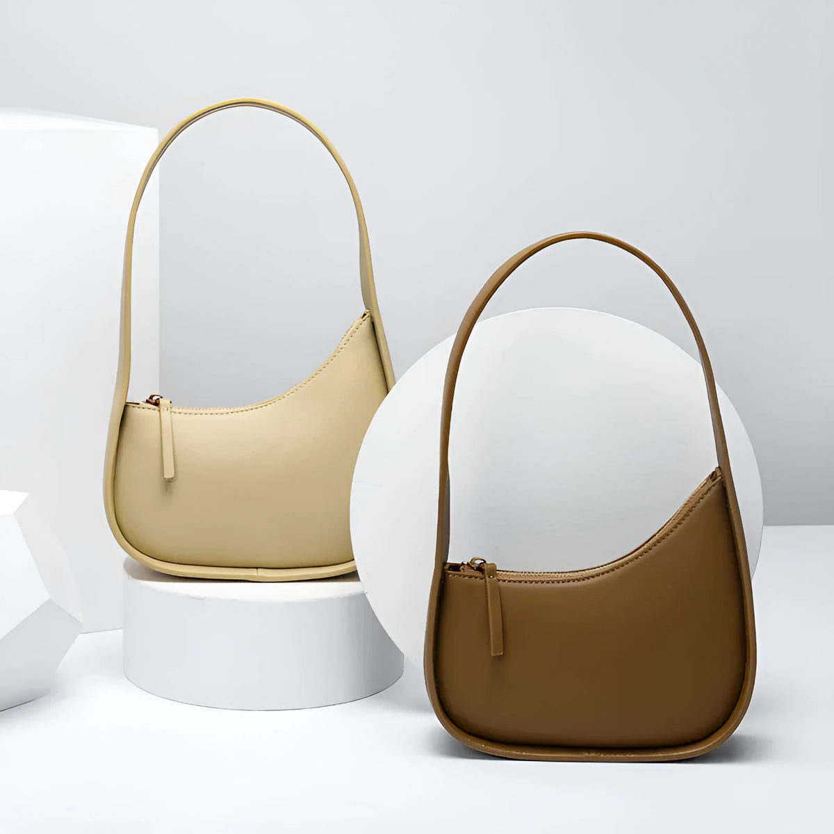 Half moon shaped leather women's shoulder bag with wide strap
