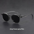 Retro oval round frame sunglasses with grey polarised lenses shown in sand black frame colour.