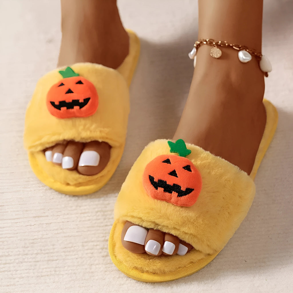 White and yellow pumpkin plush open toe slippers with cartoon Halloween design on synthetic fur