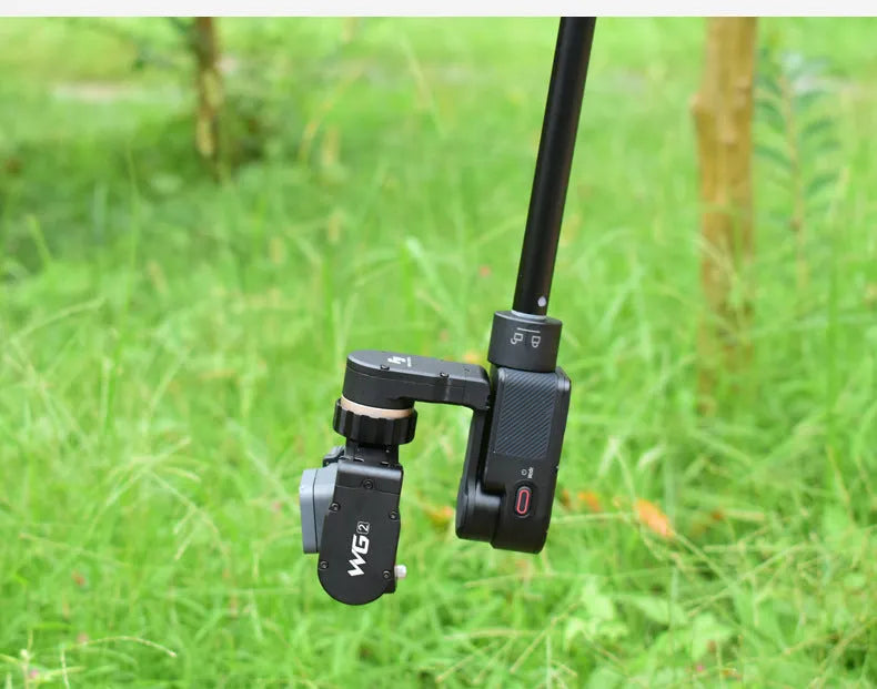 Black retractable selfie stick with integrated stabilizer, shown extended and collapsed