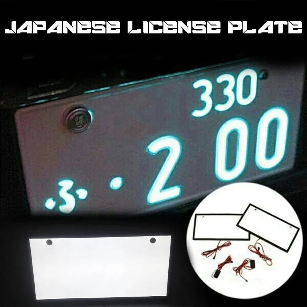 Two white plastic LED license plate lights for truck rear installation.