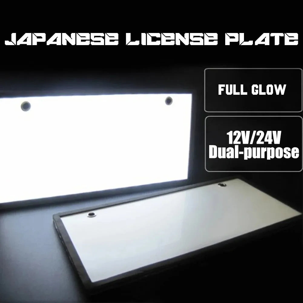 Two white plastic LED license plate lights for truck rear installation.