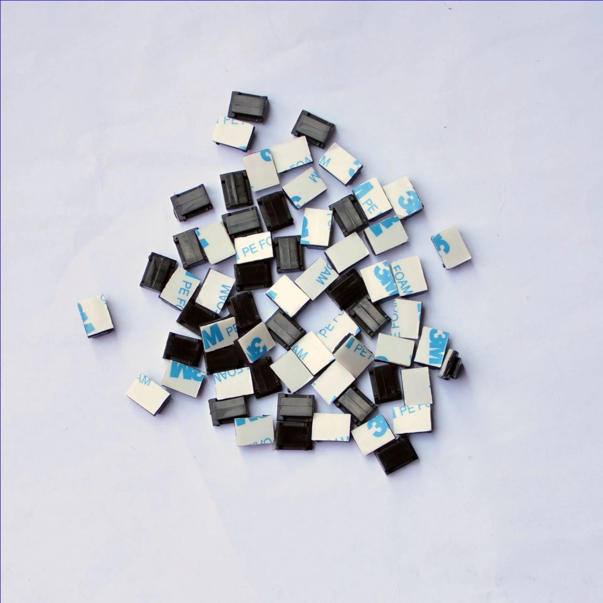 Black PA66 plastic automotive cable retaining clips for wiring management measuring 9mm by 12mm by 6.2mm