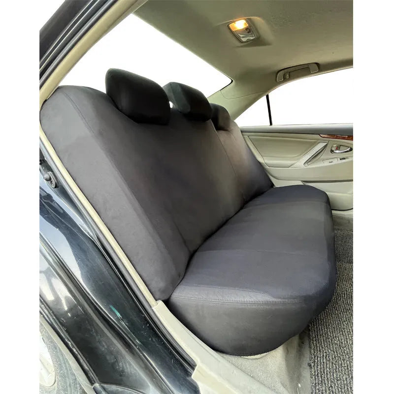 Polyester car seat cover with eyelet stitching in blue, shown on a car seat.