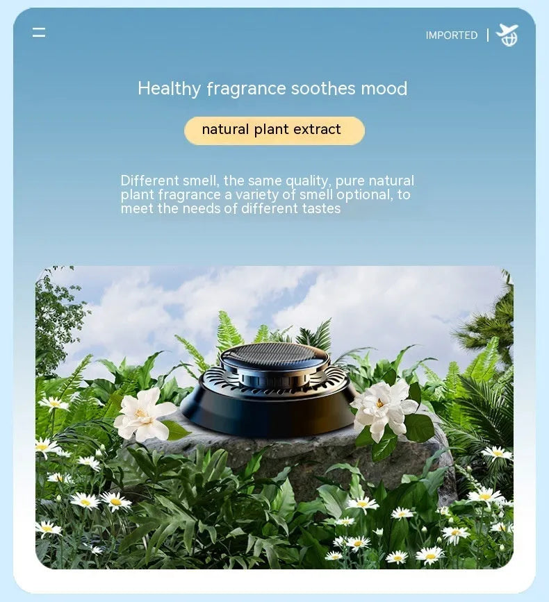 Solar powered kinetic car air freshener with rotating double rings on a black plastic base.