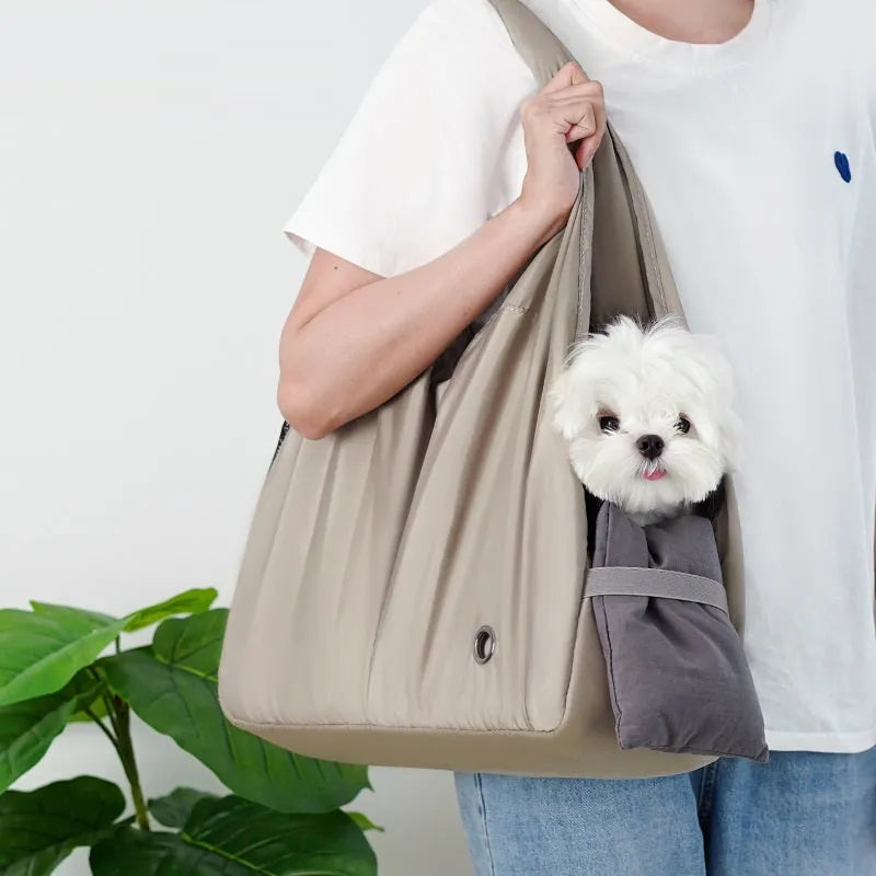 Apricot coloured cloth pet carrier handbag for small dogs and cats, shown with dimensions 41cm by 16cm by 28cm.