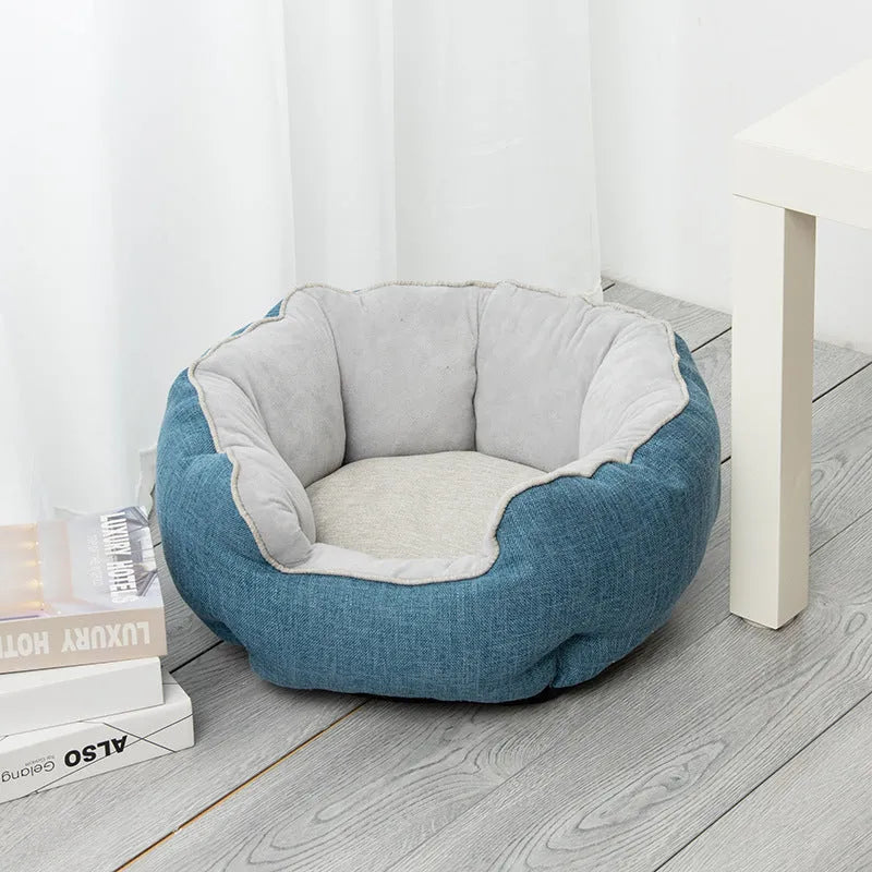 Octagonal grey pet bed with soft padded rim and removable inner mat for a small dog