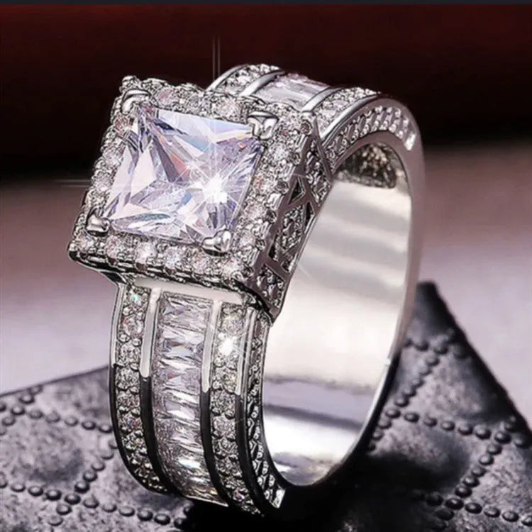Geometric women's fashion ring with electroplated metallic finish in gold or white colour options