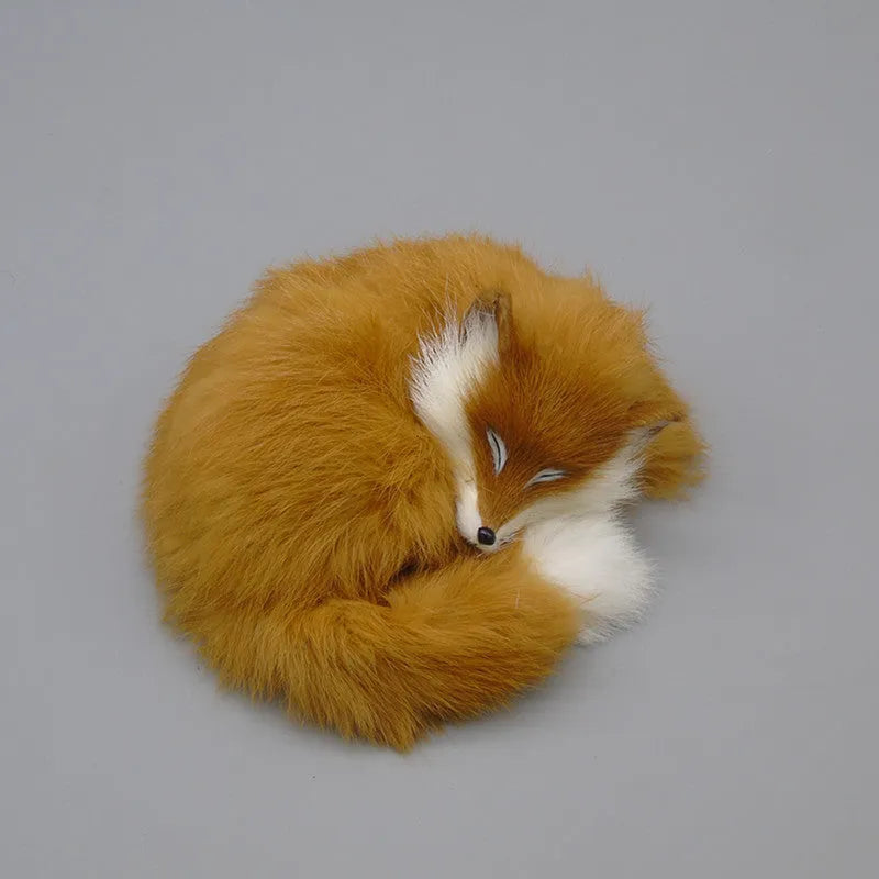 Artificial white fox fur car ornament measuring 15cm long on dashboard