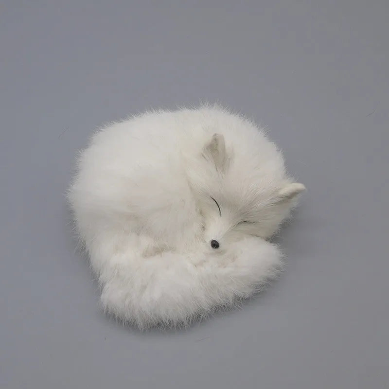 Artificial white fox fur car ornament measuring 15cm long on dashboard