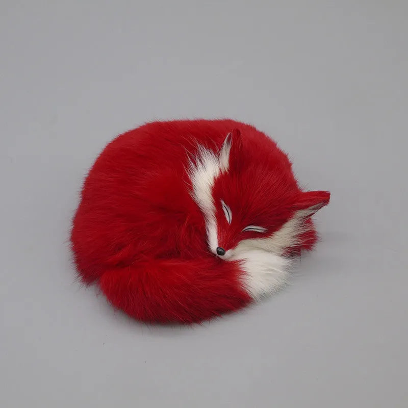 Artificial white fox fur car ornament measuring 15cm long on dashboard