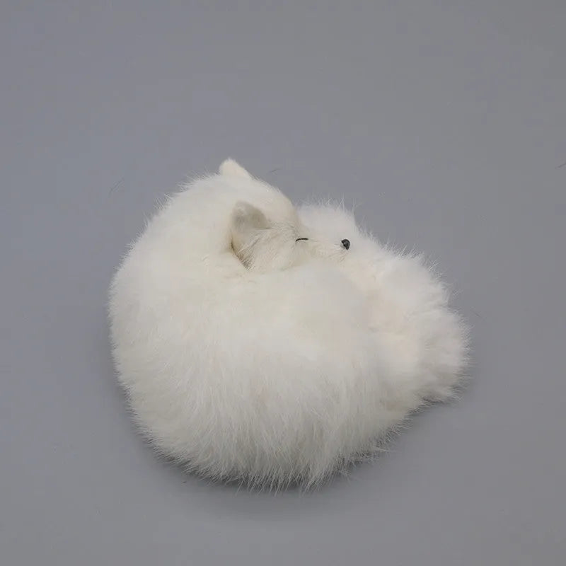 Artificial white fox fur car ornament measuring 15cm long on dashboard