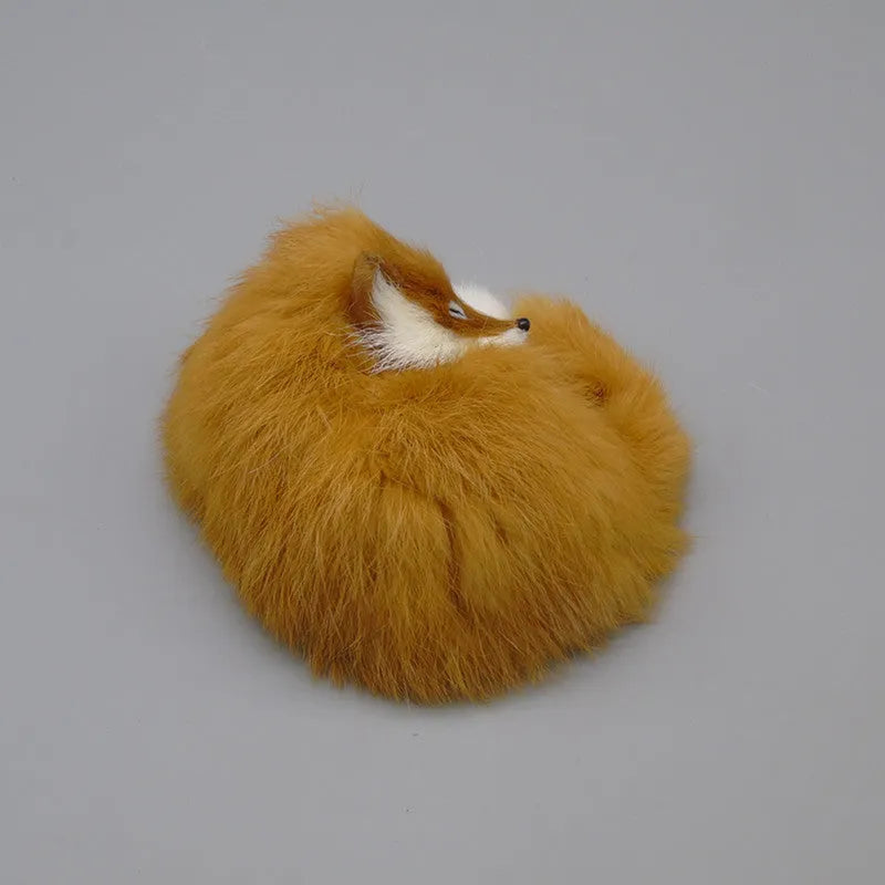Artificial white fox fur car ornament measuring 15cm long on dashboard