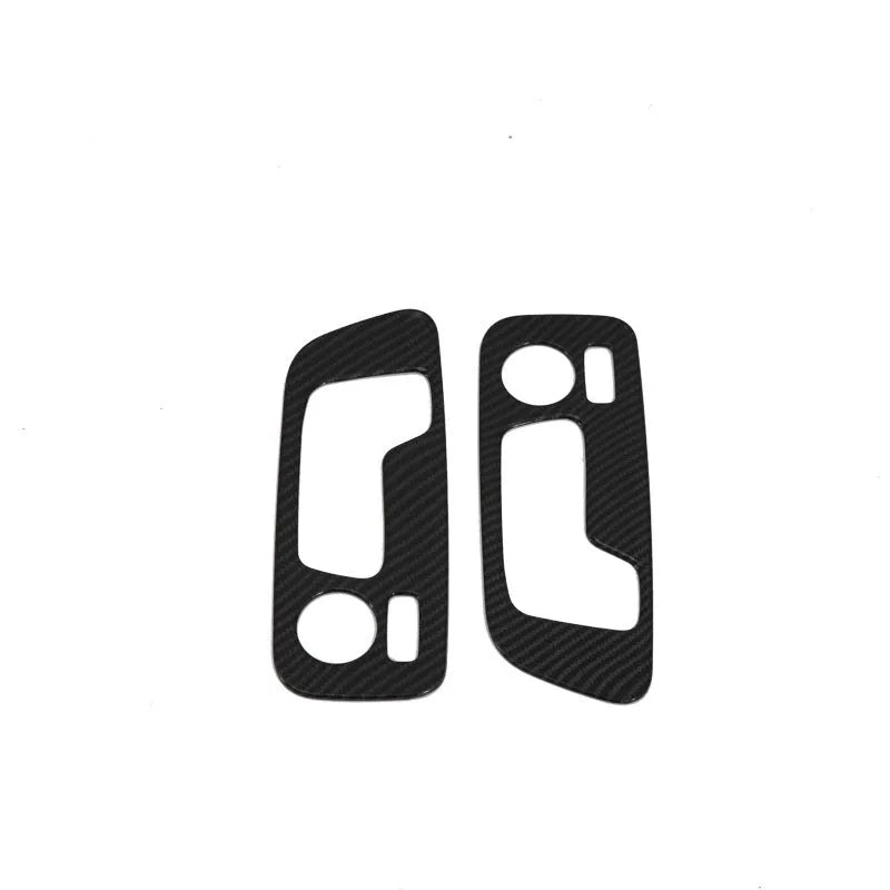 Black ABS plastic centre console trim panel for BMW X5 2019 G05 model with integrated cup holders.