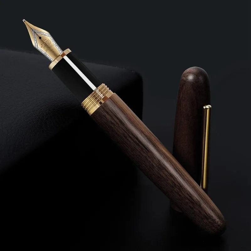 Wooden fountain pen with a rotating cap on a wooden desk, showing choice of rosewood and ebony bodies with different nibs.