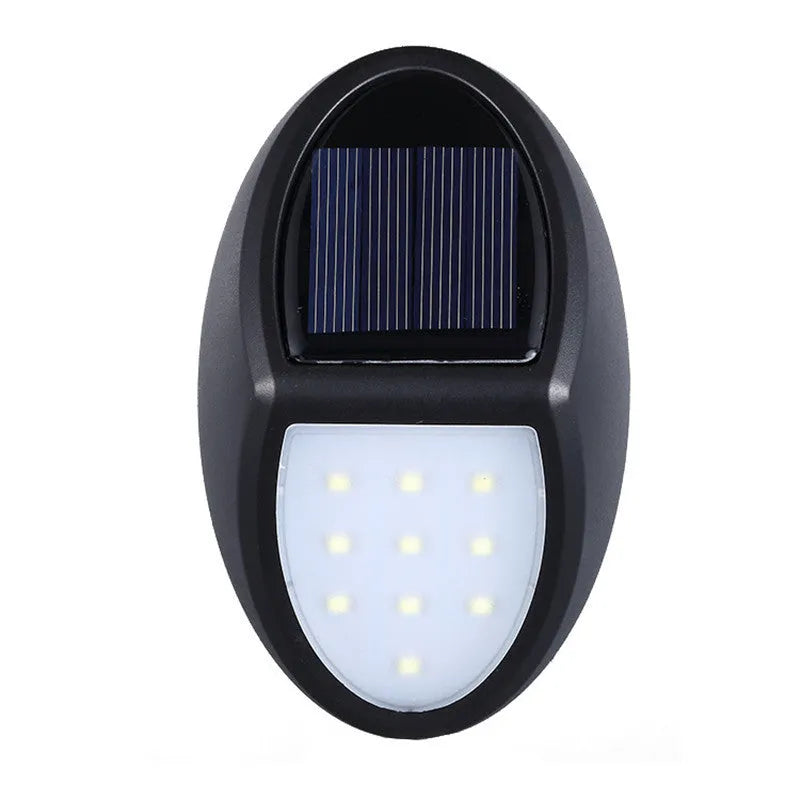 Black rectangular solar-powered LED wall light with solar panel on top.