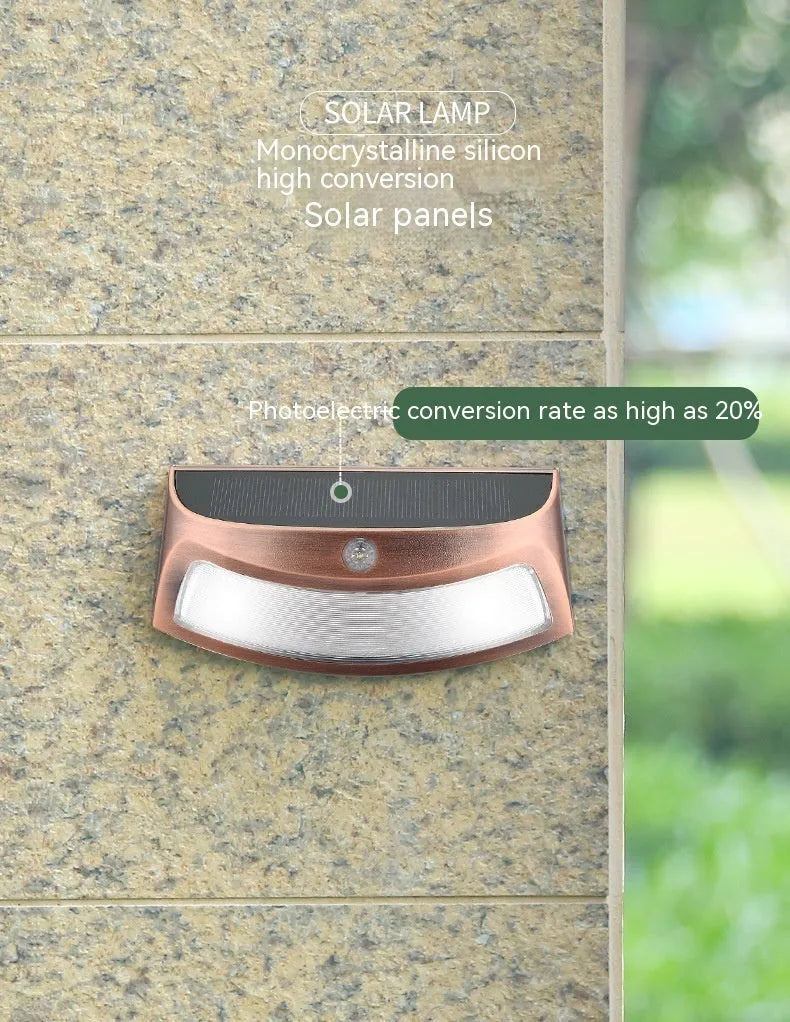 Solar outdoor wall lamp with smiling face design for garden lighting