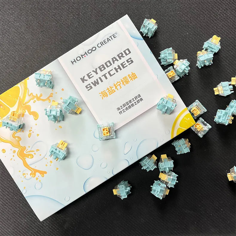 36 Sea Salt Lemon coloured PRO Mute mechanical keyboard switches laid out on a surface.