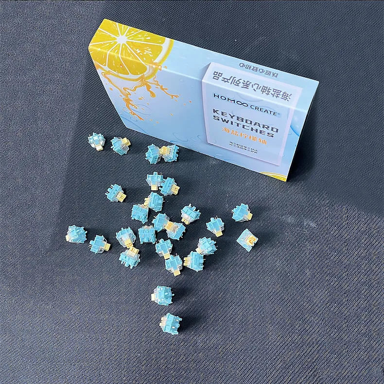 36 Sea Salt Lemon coloured PRO Mute mechanical keyboard switches laid out on a surface.