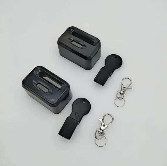 Black and red ABS plastic seat belt buckle lock holder protective device.