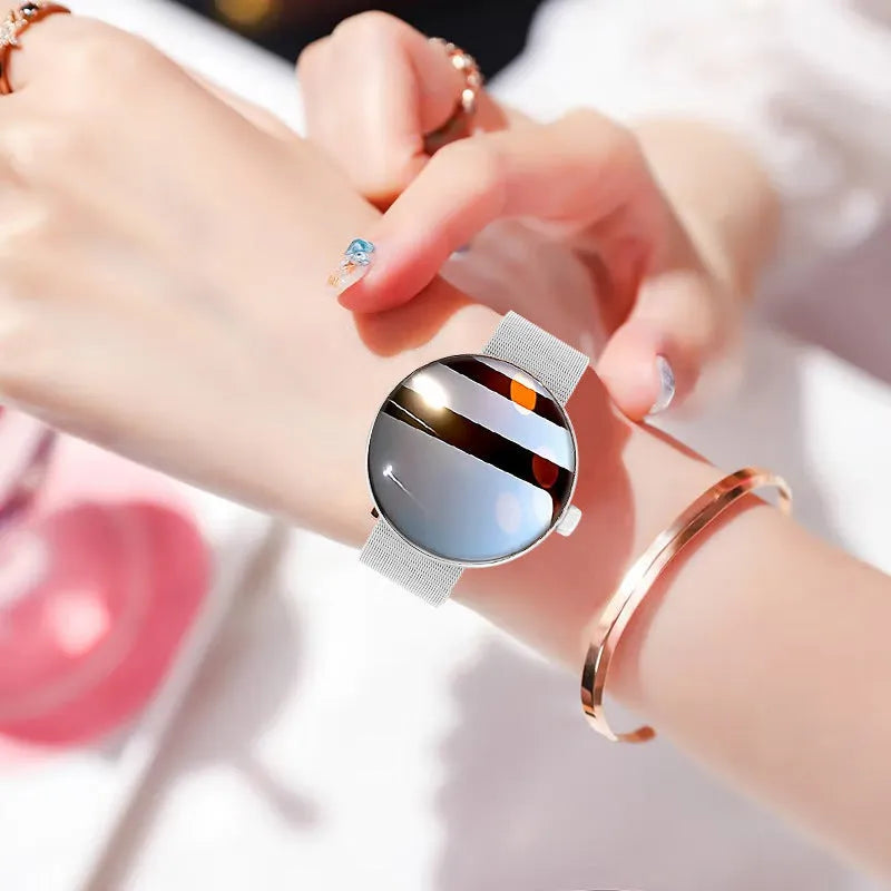 Women's smart watch with circular colour touchscreen display and metal wrist strap