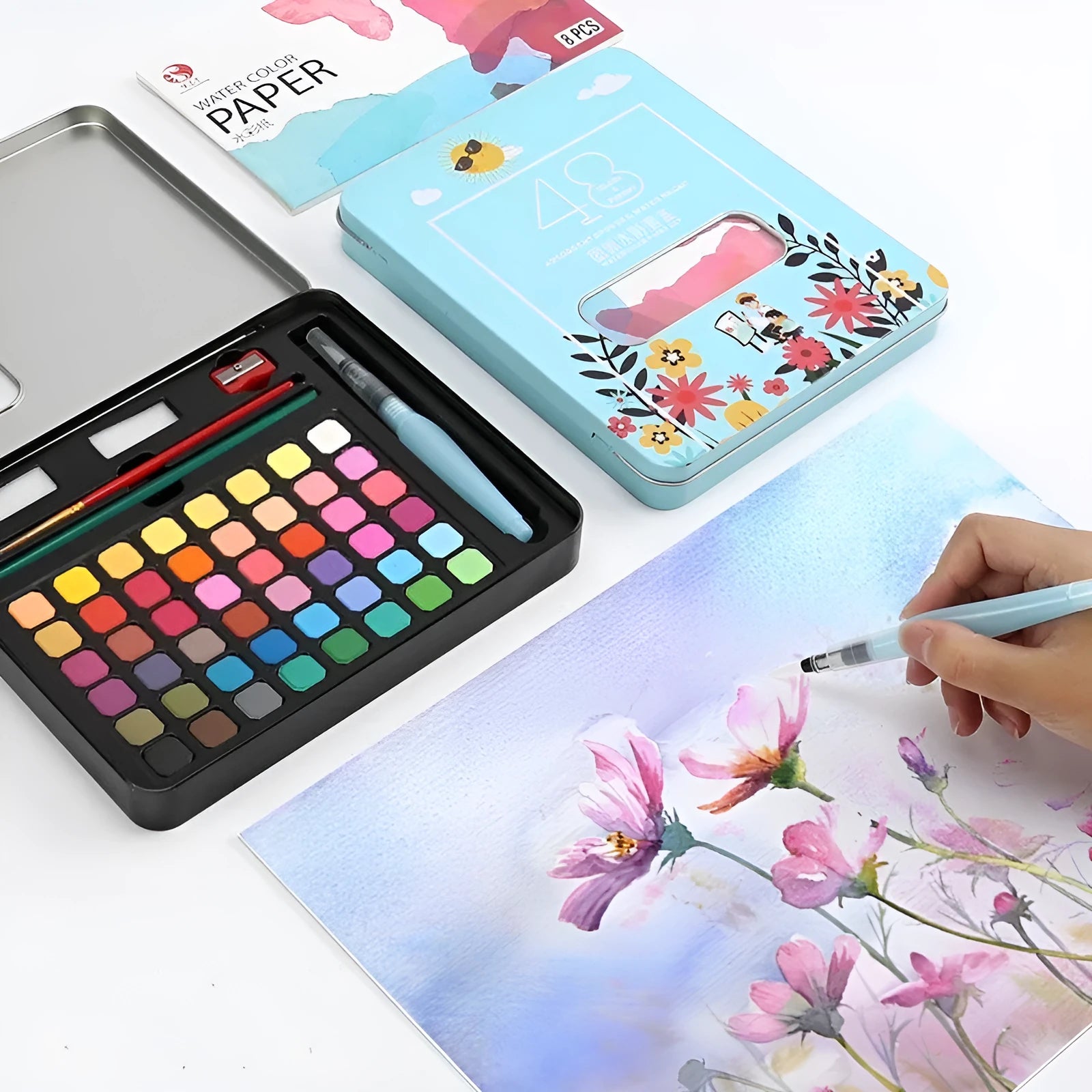 48 colour solid watercolour paint set showing Black Knight, Girl Pink and Sunshine Blue shades