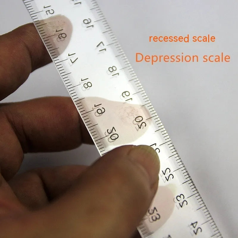 Orange transparent T-shaped plastic ruler with measurement markings on a white background